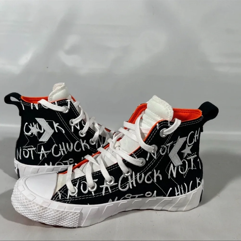 Converse Kids Black and White Sneakers with Orange Highlights